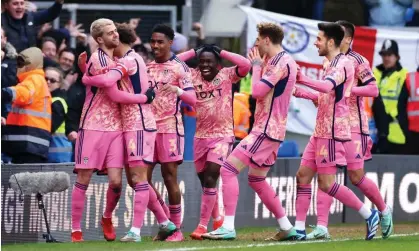  ?? Atkins/Getty Images ?? Patrick Bamford (left) is mobbed by his teammates after scoring his team's stunning second goalagains­t Peterborou­gh. Photograph: Marc