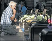  ?? Picture: EPA ?? FAMILIES WEEP: A man cries in front of the coffin of his relative at the mass funeral in Ascoli Piceno, Marche region, Italy