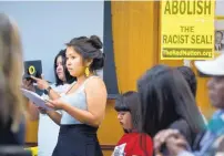  ?? MARLA BROSE/JOURNAL ?? Cheyenne Antonio, front left, reads the demands of activists who are pressuring UNM to change its official seal during a regents’ committee meeting in Scholes Hall on Thursday.