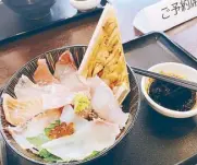  ??  ?? So fresh: A seafood bowl in Fukuoka is half the price of Tsukiji Market’s.