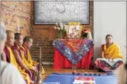  ?? RACHEL WISNIEWSKI — FOR DIGITAL FIRST MEDIA ?? Geshe Lobsang, right, leads six other monks in the opening ceremony, which involves chanting, playing musical instrument­s and moments of silence.