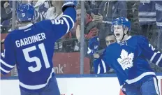  ?? CHRIS YOUNG/THE CANADIAN PRESS ?? Toronto’s William Nylander, right, celebrates with teammate Jake Gardiner after scoring a goal Tuesday against the Winnipeg Jets.