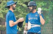  ?? BURHAAN KINU/HT ?? Shikhar Dhawan (right) speaks to India batting coach Vikram Rathour during a practice session on Saturday.
