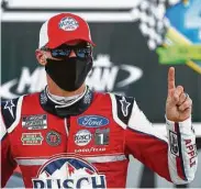  ?? Paul Sancya / Associated Press ?? Kevin Harvick celebrates winning a NASCAR Cup Series race at Michigan Internatio­nal Speedway.