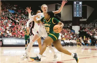  ?? KARL MONDON/BAY AREA NEWS GROUP ?? Norfolk State’s Kierra Wheeler drives against Stanford’s Cameron Brink during a first-round NCAA Tournament game Friday night at Maples Pavilion in Stanford, California. Wheeler finished with 17 points and eight rebounds.