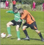  ?? Picture: Tracey Corps ?? Ashford United Colts hold off a challenge from and Charing Reserves