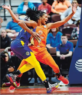  ?? SEAN D. ELLIOT/THE DAY ?? Sun forward Alyssa Thomas goes sprawling on contact with Sparks forward Nneka Ogwumike during Game 1 of their WNBA semifinal playoff series on Tuesday night at Mohegan Sun Arena. The Sun took a 1-0 series lead with an 84-75 victory.