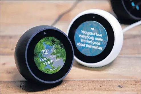  ?? AP PHOTO ?? Amazon Echo Spots are displayed during a program announcing several new Amazon products by the company, in Seattle.