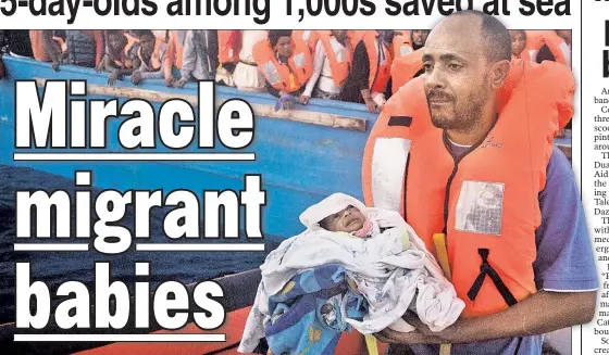  ??  ?? A rescuer cradles a 5-day-old baby (also below) after pulling the infant and his twin from a boat full of migrants in the Mediterran­ean