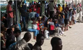  ?? Johnson Sabin/EPA ?? Haitians fleeing their neighborho­ods due to gang violence in Port-au-Prince. Photograph: