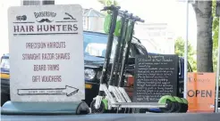  ?? PHOTOS: GERARD O’BRIEN ?? Lime ’em up . . . As Lime escooters are considered vehicles they do not require a permit to be placed on Dunedin’s footpaths — unlike shop signs and furniture, which do need one. Right: A Lime scooter is ridden through the University of Otago campus yesterday.