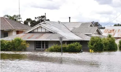  ?? Photograph: Murray Mccloskey/AAP ?? Flooded homes in Forbes, NSW. The state’s planning minister, Anthony Roberts, introduced a bill to parliament to create a ‘Reconstruc­tion Authority’.