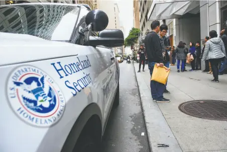  ?? Michael Short / Special to The Chronicle 2019 ?? People wait with their paperwork outside of the San Francisco Immigratio­n Court on Montgomery Street in 2019.