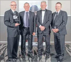  ??  ?? Happy quartet: From left, Coastguard Mana’s Trevor Farmer, Peter Feely and Trevor Burgess, and Dean Lawrence, president of Coastguard New Zealand.