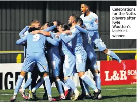  ??  ?? Celebratio­ns for the Notts players after Kyle Wootton’s last-kick winner.