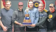  ?? CHARLES REID/ THE GUARDIAN ?? The Eddie MacKenzie rink from the Charlottet­own Curling Complex display their P. E. I. Tankard trophy after a 12- 4 win over the John Likely foursome Sunday in Cornwall. The MacKenzie rink includes, from left, skip Eddie MacKenzie, third Josh Barry,...