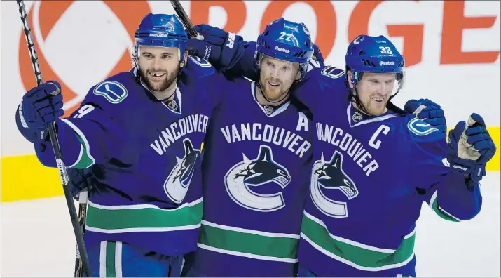  ?? — THE CANADIAN PRESS FILES ?? The Sedins are struggling, so why not give Zack Kassian, left, a shot with Daniel and Henrik where he thrived in the early going last season?