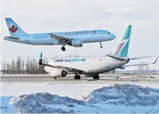  ?? ED KAISER/EDMONTON JOURNAL FILES ?? Air Canada is boosting capacity on flights to London while WestJet launches service from six Canadian cities to London this spring. The result, along with lower gas prices, likely means a break in airfares.