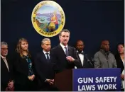  ?? JUSTIN SULLIVAN — GETTY IMAGES ?? Gov. Gavin Newsom speaks Wednesday about new gun safety legislatio­n that would establish stricter standards for concealed carry weapon permits to carry a firearm in public.