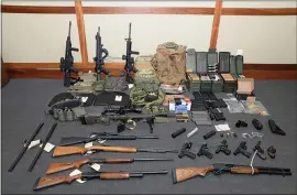  ?? PHOTO BY HO / AFP ?? This undated image released by the U.S. Attorney’s Office shows weapons reportedly seized at the Silver Spring, Md., home of U.S. Coast Guard officer Christophe­r Paul Hasson.