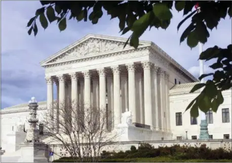  ?? JESSICA GRESKO — THE ASSOCIATED PRESS ?? In this file photo, the Supreme Court in Washington. The Supreme Court has struck down a federal law that bars gambling on football, basketball, baseball and other sports in most states, giving states the go-ahead to legalize betting on sports.