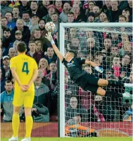  ?? Photo: Xinhua ?? Villarreal’s Geronimo Rulli tries to stop a Liverpool shot.