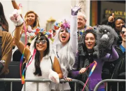  ?? Scott Strazzante / The Chronicle ?? Rain Chan-Kalin (left), Kimmy Golles and Jessica Nagel cheer marchers and in the San Francisco Pride Parade.