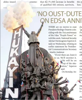  ?? PHOTO BY MIKE DE JUAN ?? 31 YEARS HENCE
An anti-Marcos group hoists a banner and balloons protesting last year’s interment of former strongman Ferdinand Marcos and marking the anniversar­y of the 1986 Edsa ‘People Power’ revolt.