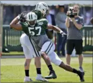  ?? SETH WENIG — THE ASSOCIATED PRESS FILE ?? In this Aug. 1 photo,New York Jets’ Obum Gwacham (57) participat­es during practice at the NFL football team’s training camp in Florham Park, N.J.