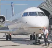  ?? STAFF FILE PHOTO ?? United Airlines pilot Josh Key does a pre-flight check of a CRJ 200 airplane prior to a flight from Chattanoog­a.