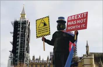  ?? FRANK AUGSTEIN — THE ASSOCIATED PRESS ?? A pro-EU protestor stands in parliament square in front of Parliament during the debate in the House of Commons on the EU (Future Relationsh­ip) Bill in London on Wednesday.