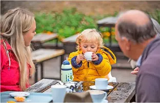  ?? Pic: James Dobson ?? A family enjoying the cafe at the Old Lodge at Dyrham Park