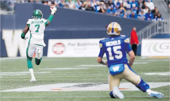  ?? JOHN WOODS/THE CANADIAN PRESS ?? Winnipeg Blue Bombers quarterbac­k Matt Nichols watches as the Roughrider­s’ Willie Jefferson returns an intercepti­on for a touchdown Saturday.