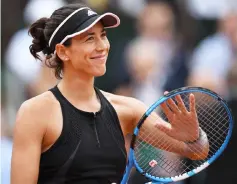  ??  ?? Muguruza celebrates after victory over Sharapova at the end of their women’s singles quarter-final match on day eleven of The Roland Garros 2018 French Open tennis tournament in Paris. — AFP photo