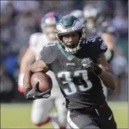  ?? JOHN BLAINE — FOR DIGITAL FIRST MEDIA ?? Eagles running back Josh Adams (33) picks up first down yardage against the Giants during Sunday’s game at Lincoln Financial Field.