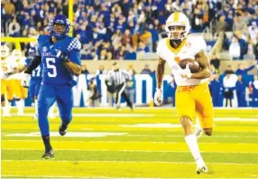  ?? AP PHOTO/MICHAEL CLUBB ?? Tennessee wide receiver Velus Jones Jr. takes a pass 72 yards for a touchdown against Kentucky last Saturday night in Lexington, Ky. Tennessee hosts Georgia this Saturday.