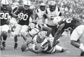  ?? CHRIS KNIGHT/ASSOCIATED PRESS ?? Maryland quarterbac­k Tyrrell Pigrome dives in for a touchdown against Penn State during the first half. This was the Terps’ first loss under new coach DJ Durkin. “We’ve had so many firsts together, so this is our first loss together,” Durkin said.