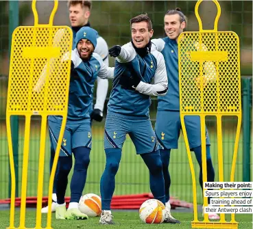  ??  ?? Making their point: Spurs players enjoy training ahead of their Antwerp clash