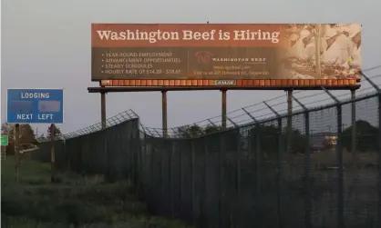  ?? Photograph: Ted S Warren/AP ?? A billboard advertises job hiring at Agri Beef’s plant in Toppenish, Washington. Donald Trump last month declared such plants to be critical to the US economy.