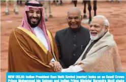  ??  ?? NEW DELHI: Indian President Ram Nath Kovind (center) looks on as Saudi Crown Prince Mohammed bin Salman and Indian Prime Minister Narendra Modi shake hands during a ceremonial reception at the presidenti­al palace yesterday. — AFP