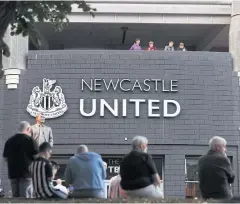  ?? REUTERS ?? Fans are seen outside Newcastle’s St James’ Park before a match.