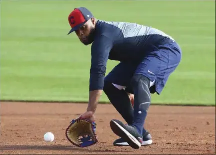  ?? ROSS D. FRANKLIN — THE ASSOCIATED PRESS ?? Carlos Santana fields a ground ball during a workout Feb. 15 in Goodyear, Ariz.