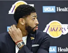  ?? AP Photo/Damian Dovarganes ?? ■ Anthony Davis listens during his introducti­on as a Los Angeles Laker at a news conference Saturday in El Segundo, Calif.