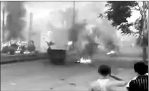 ?? — Photo by The Associated Press ?? This image made from amateur video released by the Ugarit News and accessed Wednesday purports to show burning tires in Damascus, Syria.