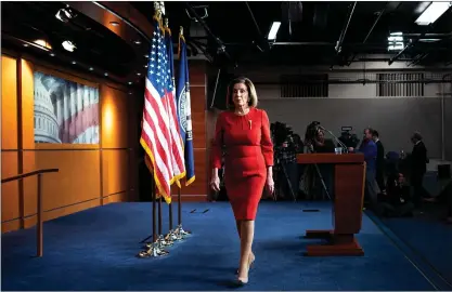  ?? ERIN SCHAFF – THE NEW YORK TIMES ?? House Speaker Nancy Pelosi, D-Calif., leaves her weekly news conference in Washington on Thursday. Pelosi played down the delay over sending impeachmen­t charges against President Trump to the Senate but declined to offer a timeline for when the House might file its case.