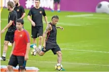  ?? MICHAEL LAUGHLIN/STAFF PHOTOGRAPH­ER ?? Barcelona’s Neymar takes a shot on goal during practice on Friday at Hard Rock Stadium.