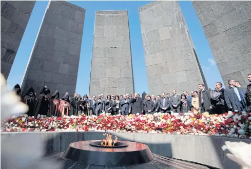  ?? AFP ?? Armenian President Armen Sarkisian, Prime Minister Nikol Pashinyan, Catholicos Garegin II, the head of the Armenian Apostolic Church, and other officials attend a ceremony commemorat­ing the 104th anniversar­y of the massacre of 1.5 million of Armenians by Ottoman forces in 1915 at the Tsitsernak­aberd memorial in Yerevan.