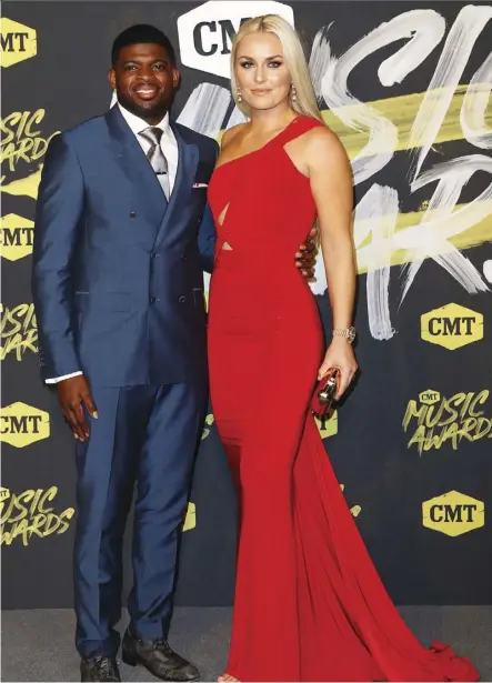  ?? JuDy eDDy/weNN.com ?? P.K. Subban and Lindsey Vonn were dressed to kill at the 2018 CMT Music Awards.