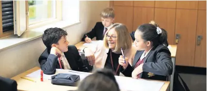  ??  ?? Cathedral School head Clare Sherwood teaching senior pupils