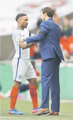  ??  ?? England’s Jermain Defoe (left) is congratula­ted by manager Gareth Southgate after being substitute­d during 2018 World Cup Qualifying European Zone - Group F match between England and Lithuania at Wembley Stadium in London. — Reuters photo